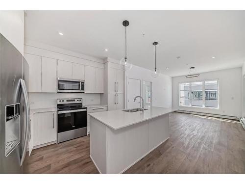 2319-681 Savanna Boulevard Ne, Calgary, AB - Indoor Photo Showing Kitchen With Stainless Steel Kitchen With Double Sink With Upgraded Kitchen