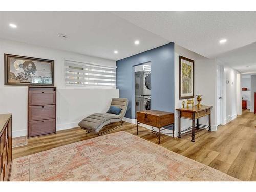 120 Oakside Circle Sw, Calgary, AB - Indoor Photo Showing Living Room With Fireplace