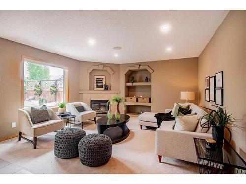 401 Chaparral Drive Se, Calgary, AB - Indoor Photo Showing Living Room With Fireplace