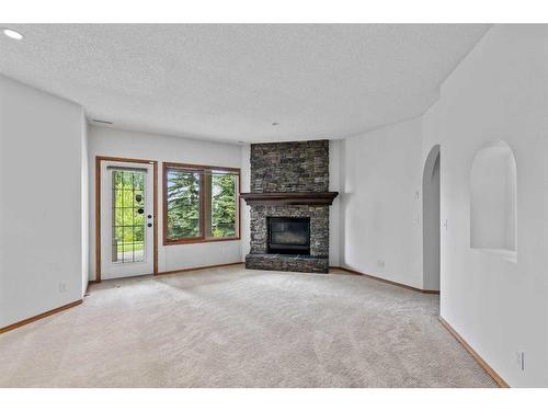 79 Mt Assiniboine Circle Se, Calgary, AB - Indoor Photo Showing Living Room With Fireplace