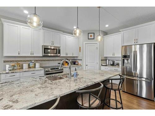 26 Stone Garden Crescent, Carstairs, AB - Indoor Photo Showing Kitchen With Double Sink With Upgraded Kitchen