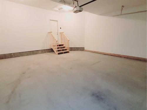 26 Stone Garden Crescent, Carstairs, AB - Indoor Photo Showing Garage