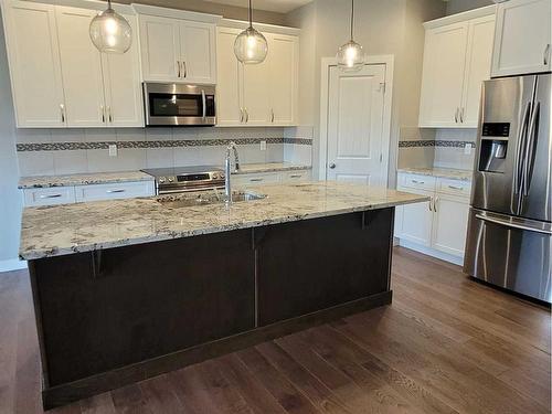 26 Stone Garden Crescent, Carstairs, AB - Indoor Photo Showing Kitchen