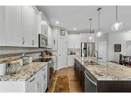 26 Stone Garden Crescent, Carstairs, AB - Indoor Photo Showing Kitchen With Double Sink With Upgraded Kitchen