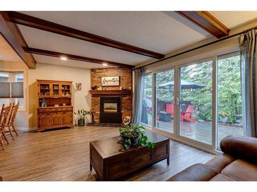 11-10910 Bonaventure Drive Se, Calgary, AB - Indoor Photo Showing Living Room With Fireplace