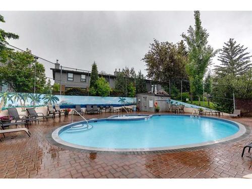 11-10910 Bonaventure Drive Se, Calgary, AB - Outdoor With In Ground Pool With Deck Patio Veranda With Backyard