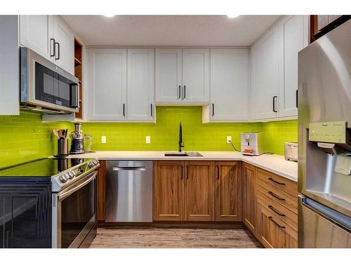 11-10910 Bonaventure Drive Se, Calgary, AB - Indoor Photo Showing Kitchen With Stainless Steel Kitchen