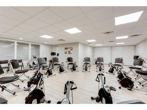 415-2635 Eversyde Avenue Sw, Calgary, AB - Indoor Photo Showing Gym Room