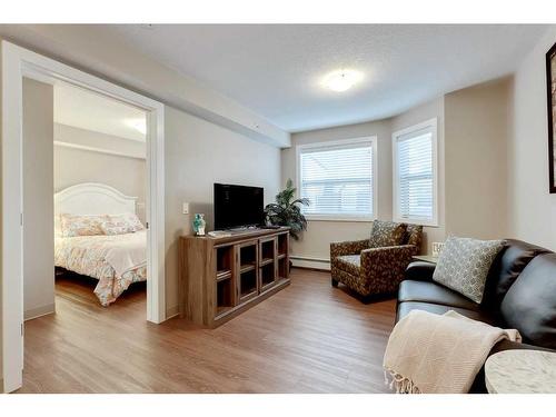 415-2635 Eversyde Avenue Sw, Calgary, AB - Indoor Photo Showing Living Room