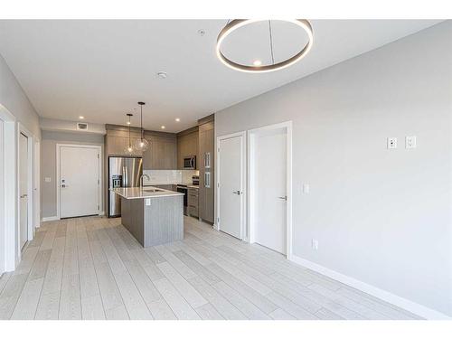 2111-681 Savanna Boulevard Ne, Calgary, AB - Indoor Photo Showing Kitchen