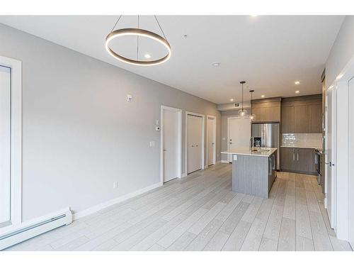 2111-681 Savanna Boulevard Ne, Calgary, AB - Indoor Photo Showing Kitchen