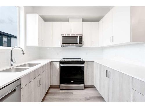 357-301 Redstone Boulevard Ne, Calgary, AB - Indoor Photo Showing Kitchen With Double Sink