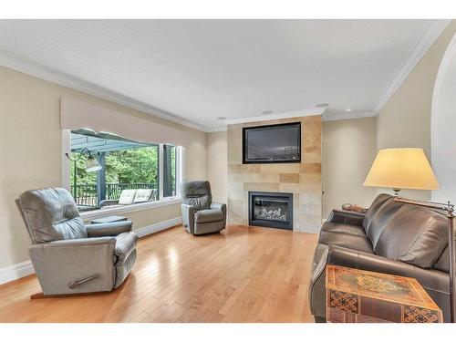 77 Signature Close Sw, Calgary, AB - Indoor Photo Showing Living Room With Fireplace