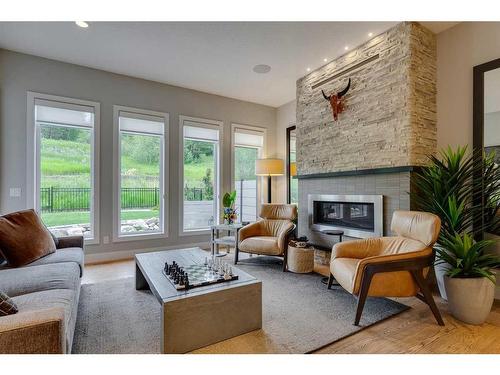 164 Cranbrook Drive Se, Calgary, AB - Indoor Photo Showing Living Room With Fireplace