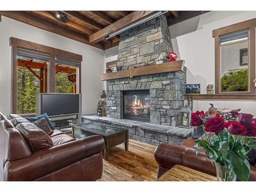 116 Eagle Terrace Road, Canmore, AB - Indoor Photo Showing Living Room With Fireplace