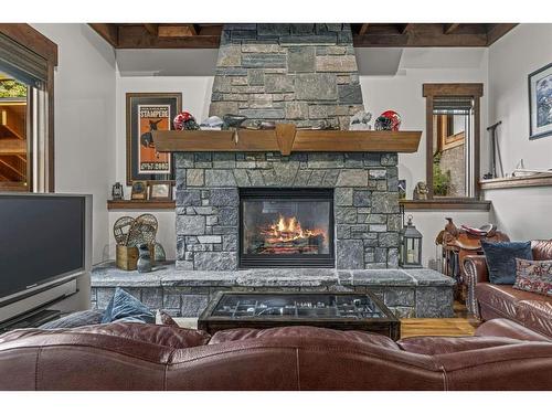 116 Eagle Terrace Road, Canmore, AB - Indoor Photo Showing Living Room With Fireplace