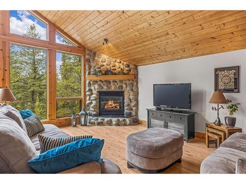 116 Eagle Terrace Road, Canmore, AB - Indoor Photo Showing Living Room With Fireplace