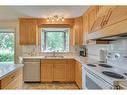 506 Silvergrove Drive Nw, Calgary, AB  - Indoor Photo Showing Kitchen With Double Sink 