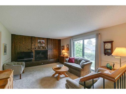 506 Silvergrove Drive Nw, Calgary, AB - Indoor Photo Showing Living Room With Fireplace