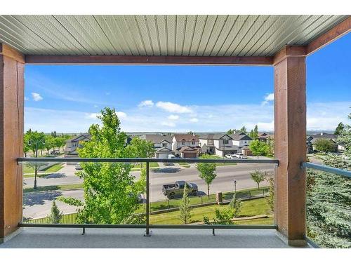 1310-92 Crystal Shores Road, Okotoks, AB - Outdoor With Balcony With View