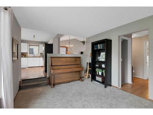 143 Sunvista Close Se, Calgary, AB - Indoor With Fireplace