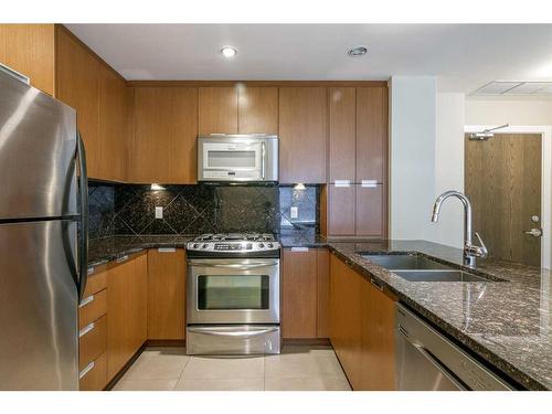 1207-99 Spruce Place Sw, Calgary, AB - Indoor Photo Showing Kitchen With Stainless Steel Kitchen With Double Sink With Upgraded Kitchen