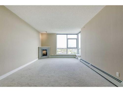 1207-99 Spruce Place Sw, Calgary, AB - Indoor With Fireplace