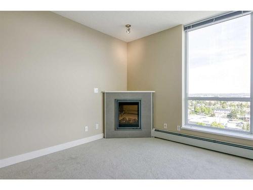 1207-99 Spruce Place Sw, Calgary, AB - Indoor With Fireplace