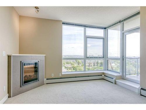 1207-99 Spruce Place Sw, Calgary, AB - Indoor With Fireplace
