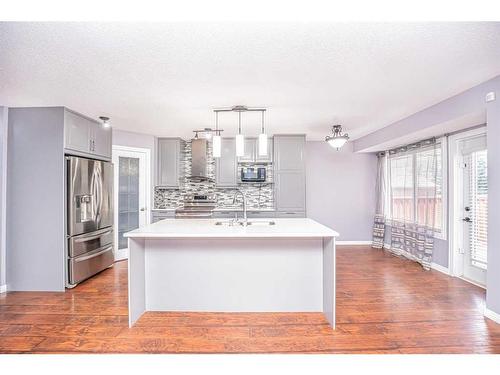 681 Coventry Drive, Calgary, AB - Indoor Photo Showing Kitchen With Stainless Steel Kitchen With Double Sink