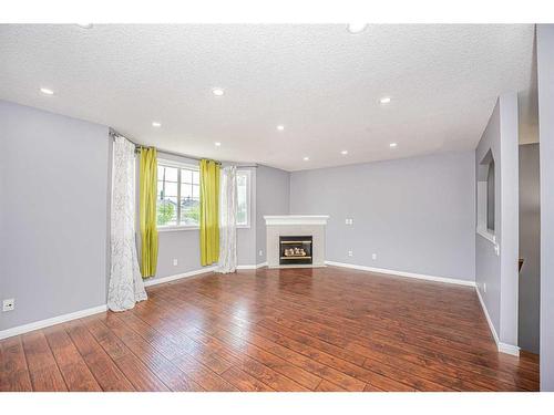 681 Coventry Drive, Calgary, AB - Indoor Photo Showing Living Room With Fireplace