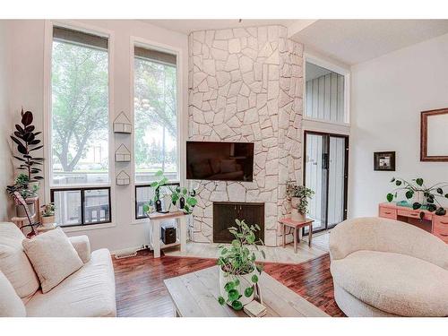 43-10401 19 Street Sw, Calgary, AB - Indoor Photo Showing Living Room With Fireplace