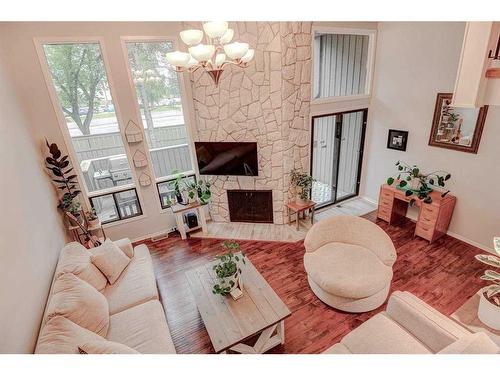 43-10401 19 Street Sw, Calgary, AB - Indoor Photo Showing Living Room With Fireplace