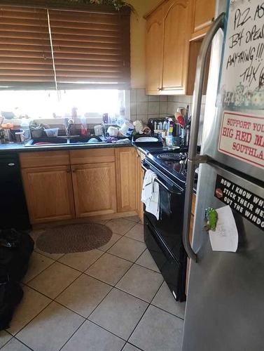 372 Penswood Way Se, Calgary, AB - Indoor Photo Showing Kitchen With Double Sink