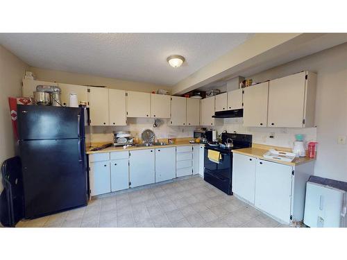 D-12 Manning Street, Red Deer, AB - Indoor Photo Showing Kitchen With Double Sink