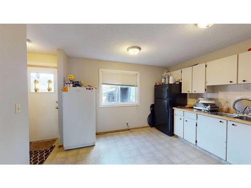 D-12 Manning Street, Red Deer, AB - Indoor Photo Showing Kitchen With Double Sink