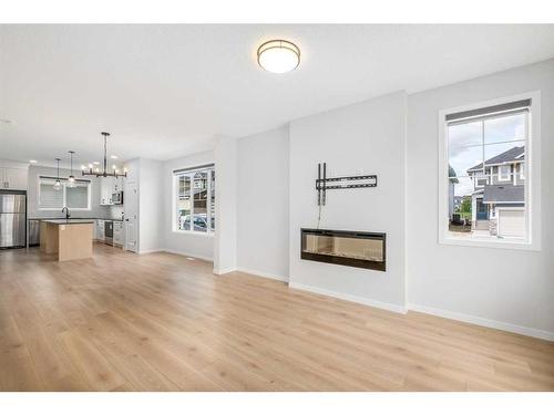 95 Sage Hill Lane Nw, Calgary, AB - Indoor Photo Showing Living Room With Fireplace