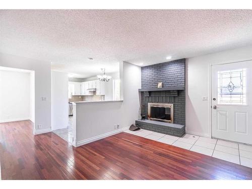 427 Brookpark Drive Sw, Calgary, AB - Indoor Photo Showing Living Room With Fireplace