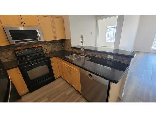 4309-70 Panamount Drive Nw, Calgary, AB - Indoor Photo Showing Kitchen With Double Sink