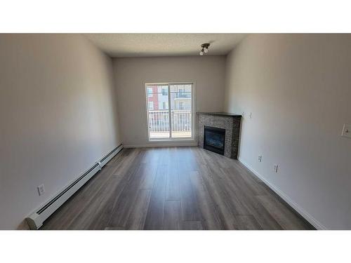 4309-70 Panamount Drive Nw, Calgary, AB - Indoor Photo Showing Living Room With Fireplace