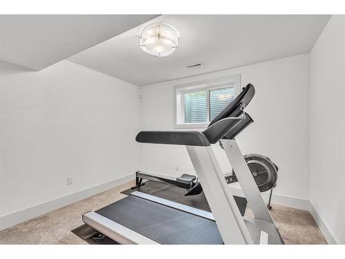 655 Wilderness Drive Se, Calgary, AB - Indoor Photo Showing Gym Room