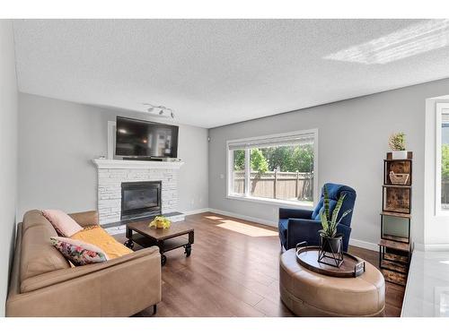 72 Arbour Ridge Way Nw, Calgary, AB - Indoor Photo Showing Living Room With Fireplace
