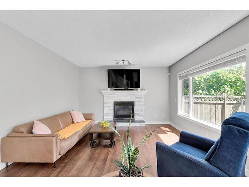 72 Arbour Ridge Way Nw, Calgary, AB - Indoor Photo Showing Living Room With Fireplace