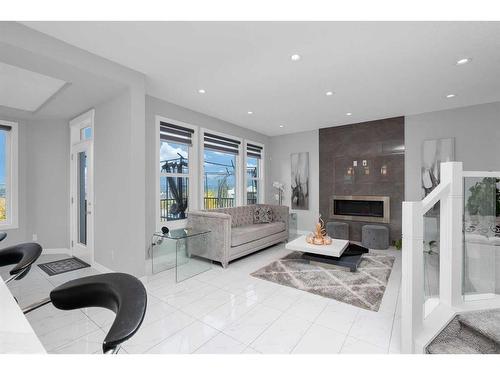 233 Crestmont Drive Sw, Calgary, AB - Indoor Photo Showing Living Room With Fireplace