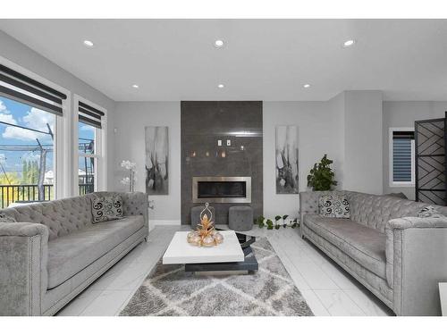 233 Crestmont Drive Sw, Calgary, AB - Indoor Photo Showing Living Room With Fireplace