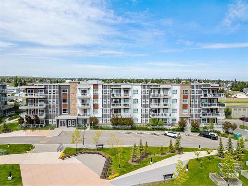 201-360 Harvest Hills Common Ne, Calgary, AB - Outdoor With Balcony With Facade