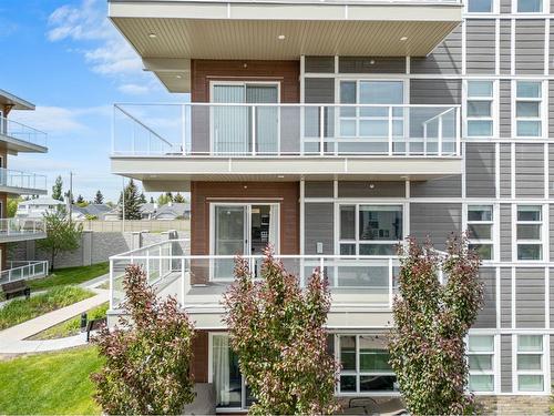 201-360 Harvest Hills Common Ne, Calgary, AB - Outdoor With Balcony With Facade