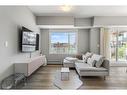 201-360 Harvest Hills Common Ne, Calgary, AB  - Indoor Photo Showing Living Room 