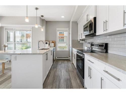 201-360 Harvest Hills Common Ne, Calgary, AB - Indoor Photo Showing Kitchen With Upgraded Kitchen