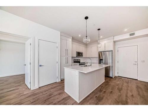 2211-681 Savanna Boulevard Ne, Calgary, AB - Indoor Photo Showing Kitchen